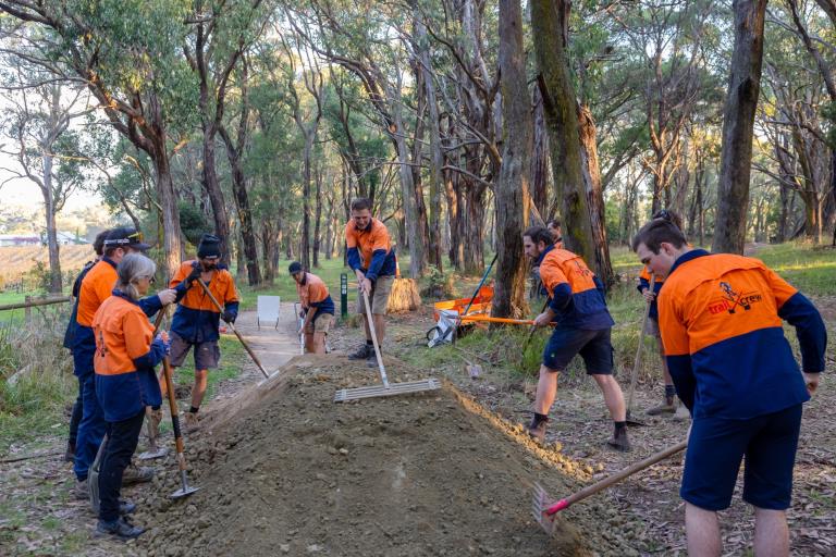 Volunteers construct a mountain bike trail