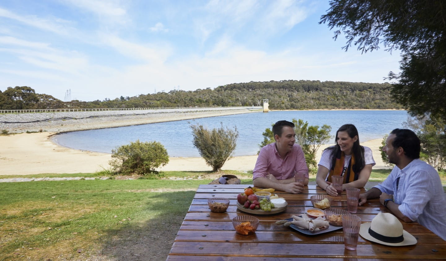 A group of people picnicking at Lysterfield Lake.