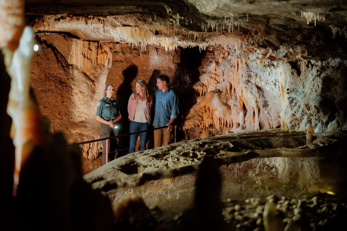 Visitors with Parks Victoria ranger hosting Buchan Caves tour.