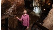 Woman exploring Fairy cave, Buchan Caves Reserve