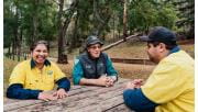 Representatives from the Gunaikurnai Land and Water Aboriginal Corporation sit with Parks Victoria Rangers at Buchan Caves Reserve.