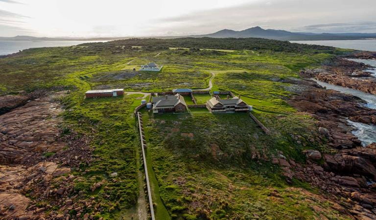 The view north from the lighthouse at Gabo Island with the mountains of Croajingolong National Park in the background
