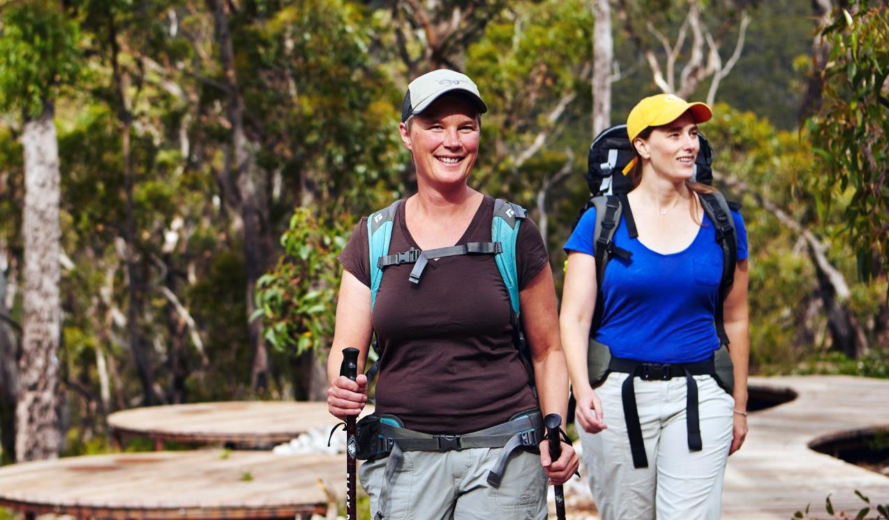 Two women hike through the Grampians National Park. 