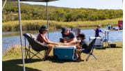 A family camps on the shores of Aire River in the Great Otway National Park