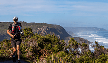 A male runs along the Great Ocean Walk track