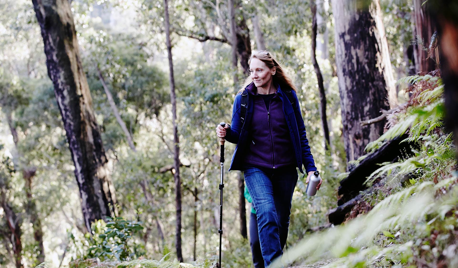 A women walks through Kinglake National Park. 