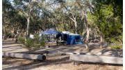 A blue tent and small marquee set up at Horsehoe Bend Campground in Little Desert National Park 