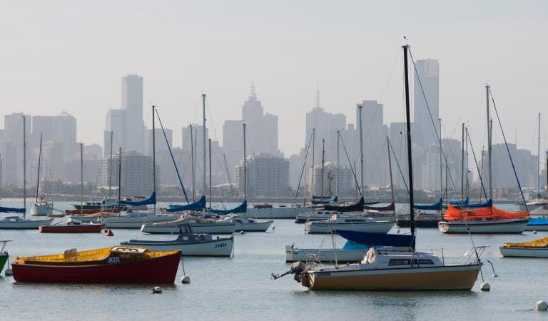 Boats moored in Port Phillip in front of Melbourne's skyline. 