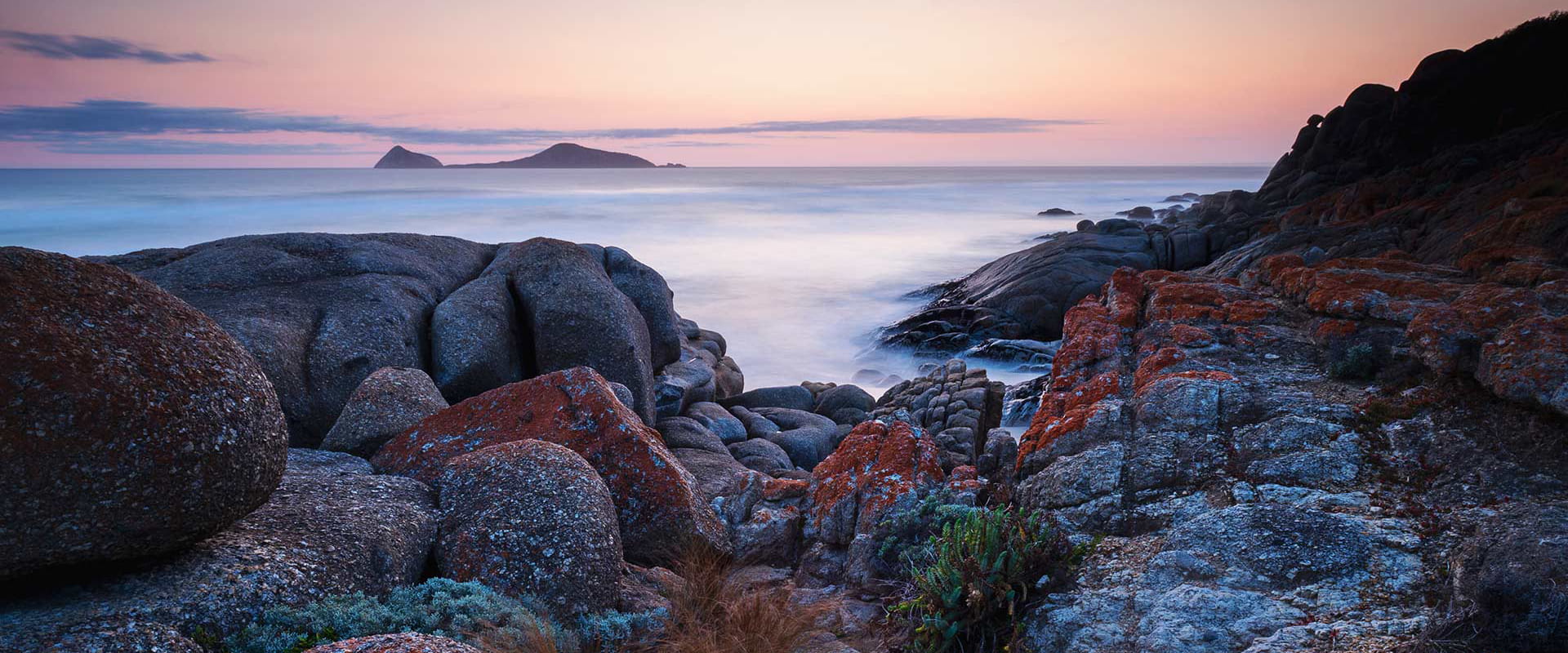 Sunset over water and rocks at Whisky Bay, Wilsons Promontory National Park