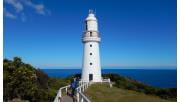 People take a photograph of the lighthouse at Cape Otway in the Otway National Park.