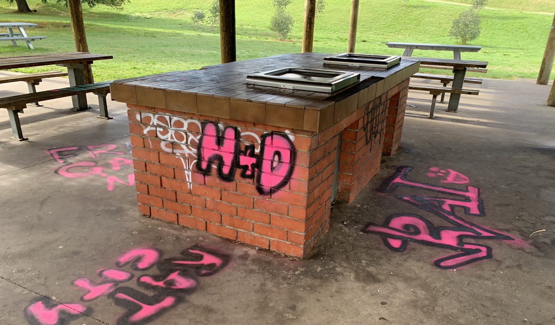 Graffiti on barbecue infrastructure following illegal raves at Yarra Bend Park