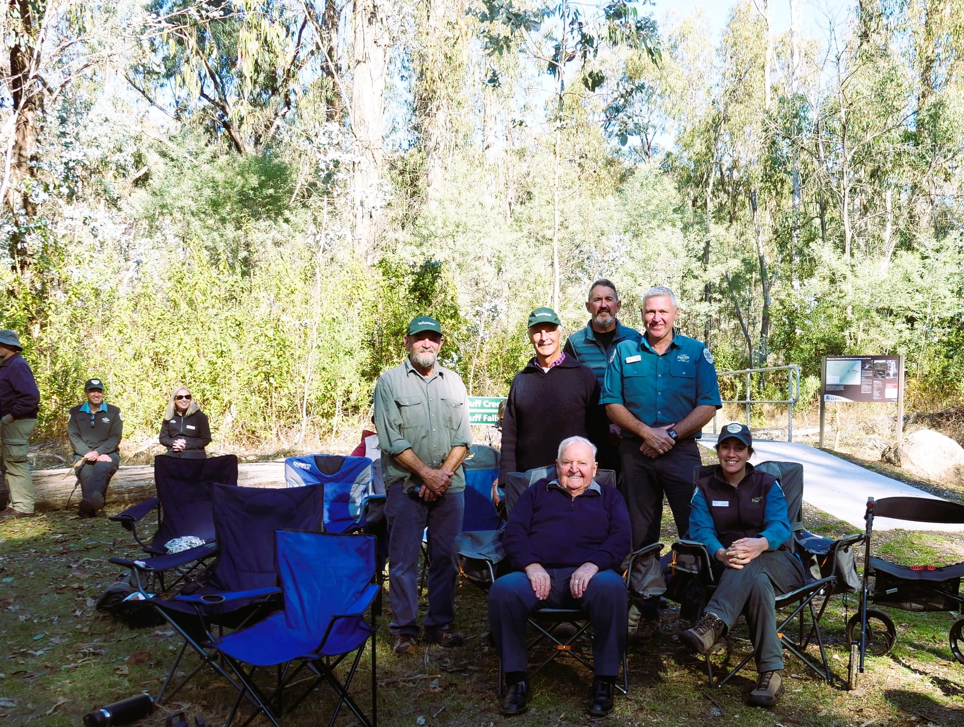 Bill Carkeek sitting with Friends of Murray Mountain Parks and Parks Victoria Rangers