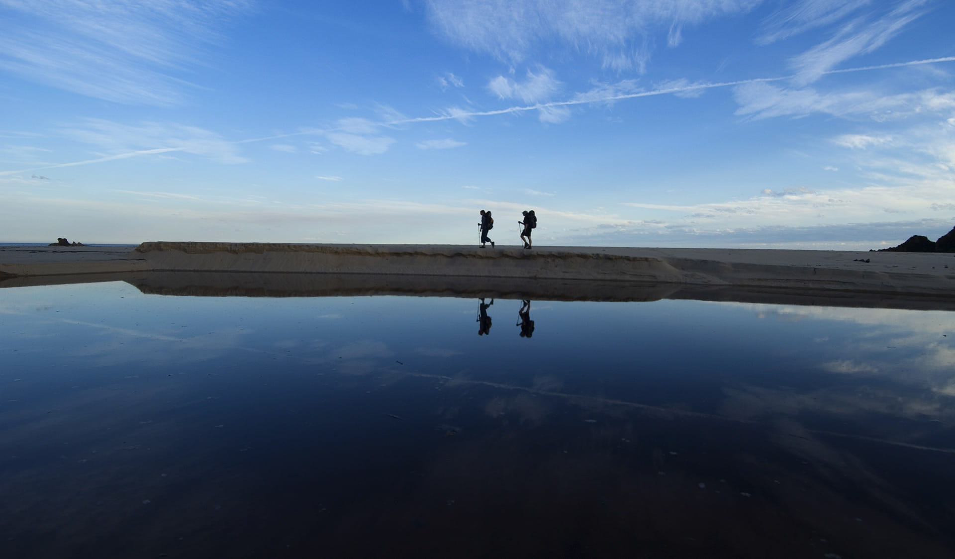 Two hikers at sunset in the Croajingolong National Park.