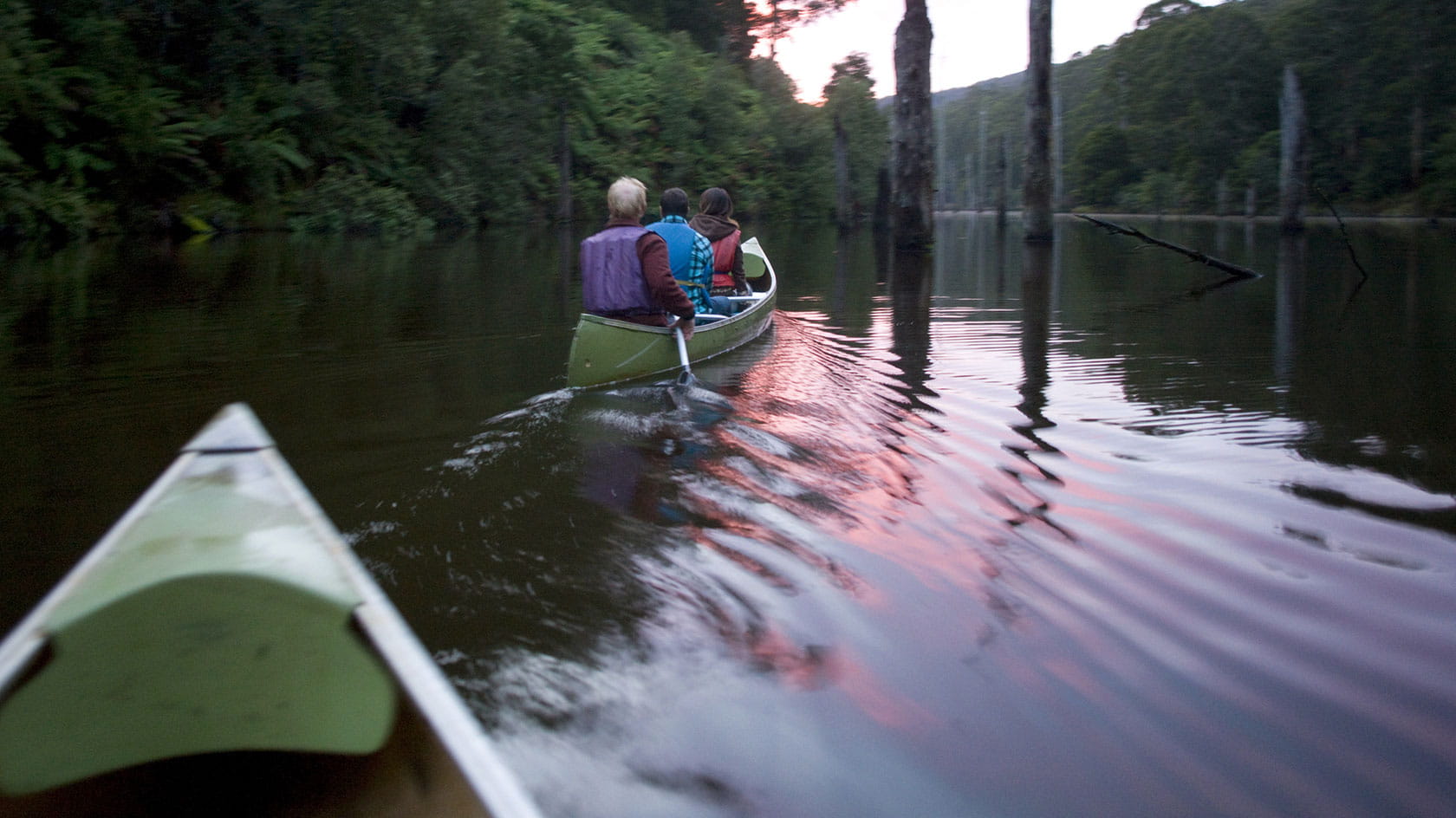 People canoeing on a lake