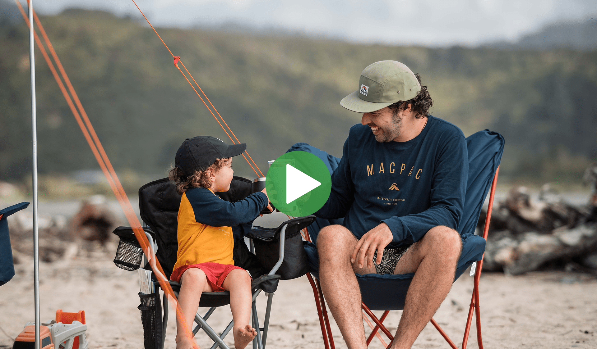 A father and son cheers in Macpac chairs