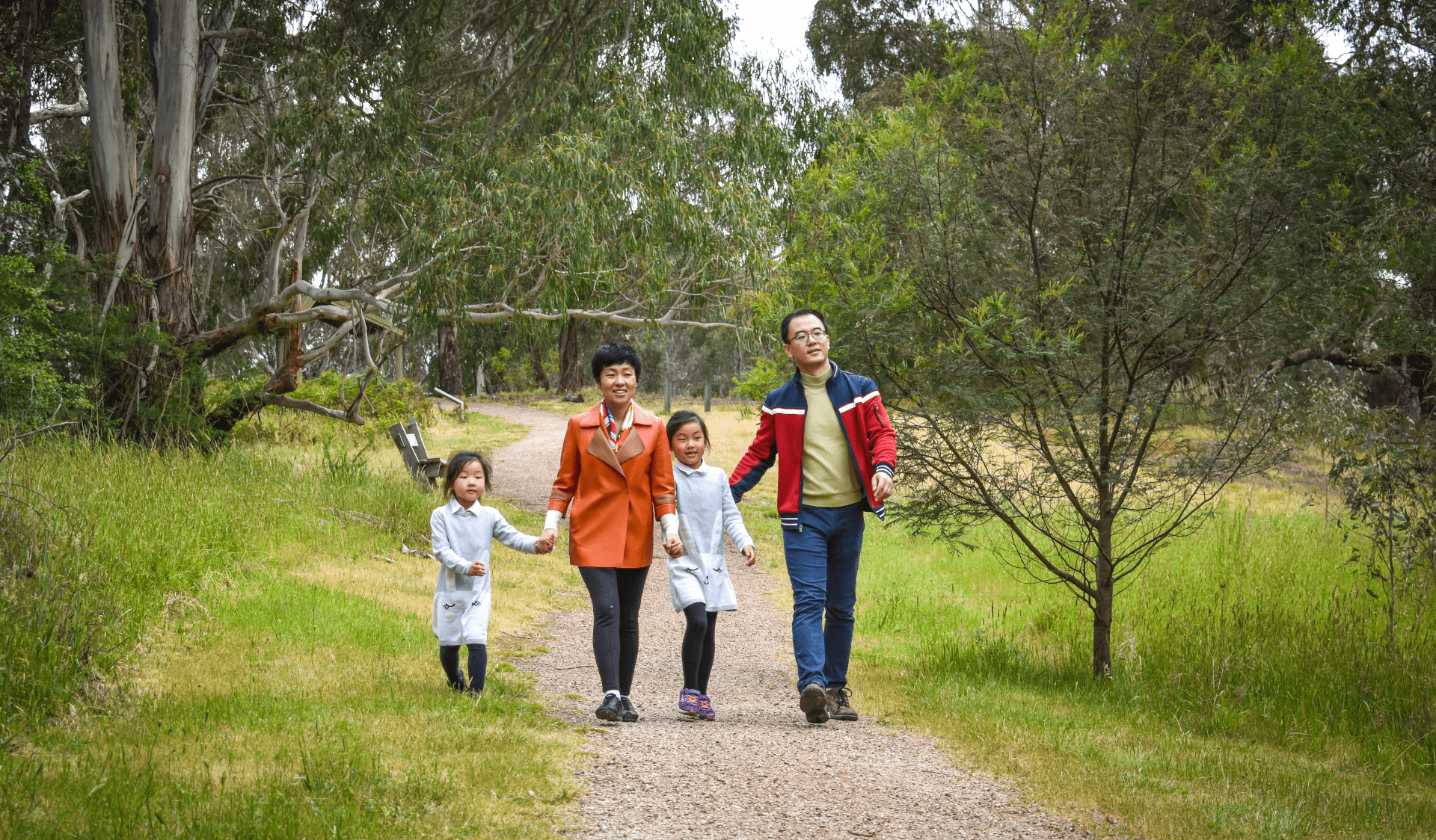 A family walking in Westerfolds Park