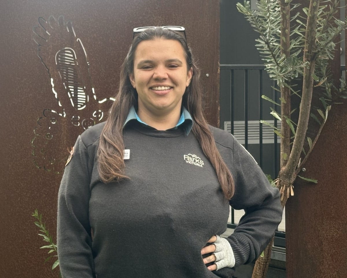 Taungurung Ranger Nartika Taylor smiling to the camera and wearing Parks Victoria uniform