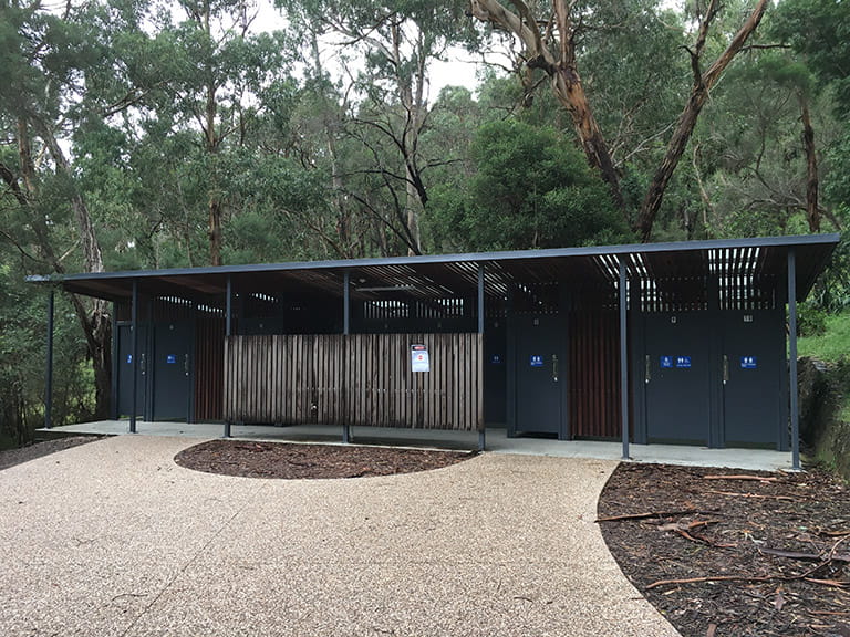 Toilet block in the middle of the picnic area at Ferntree Gully