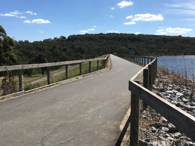 Sealed service road on top of the dam wall at Lysterfield Park.