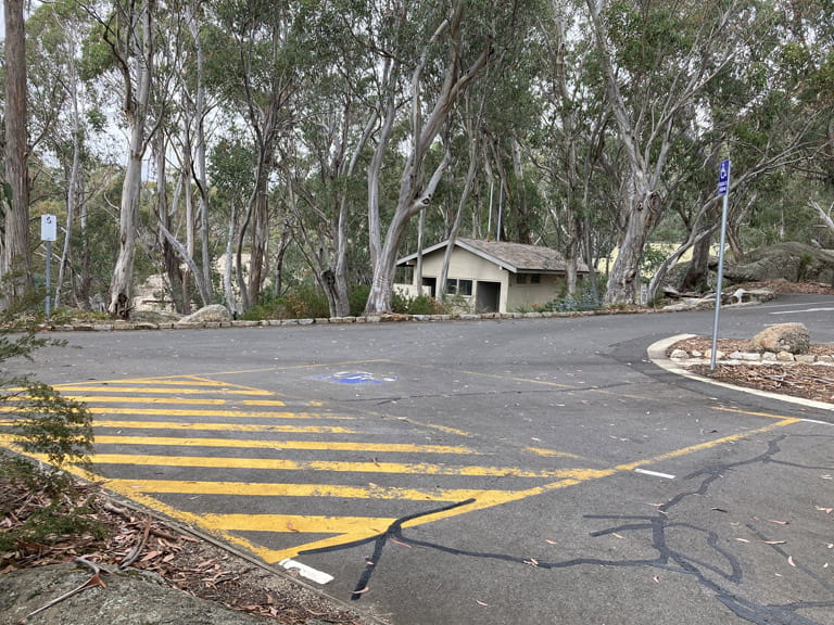 Mount Buffalo The Gorge viewing area disabled parking in carpark with the toilet block in the background