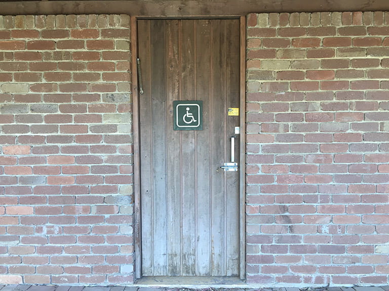Entrance to the unisex accessible toilet at Organ Pipes National Park.