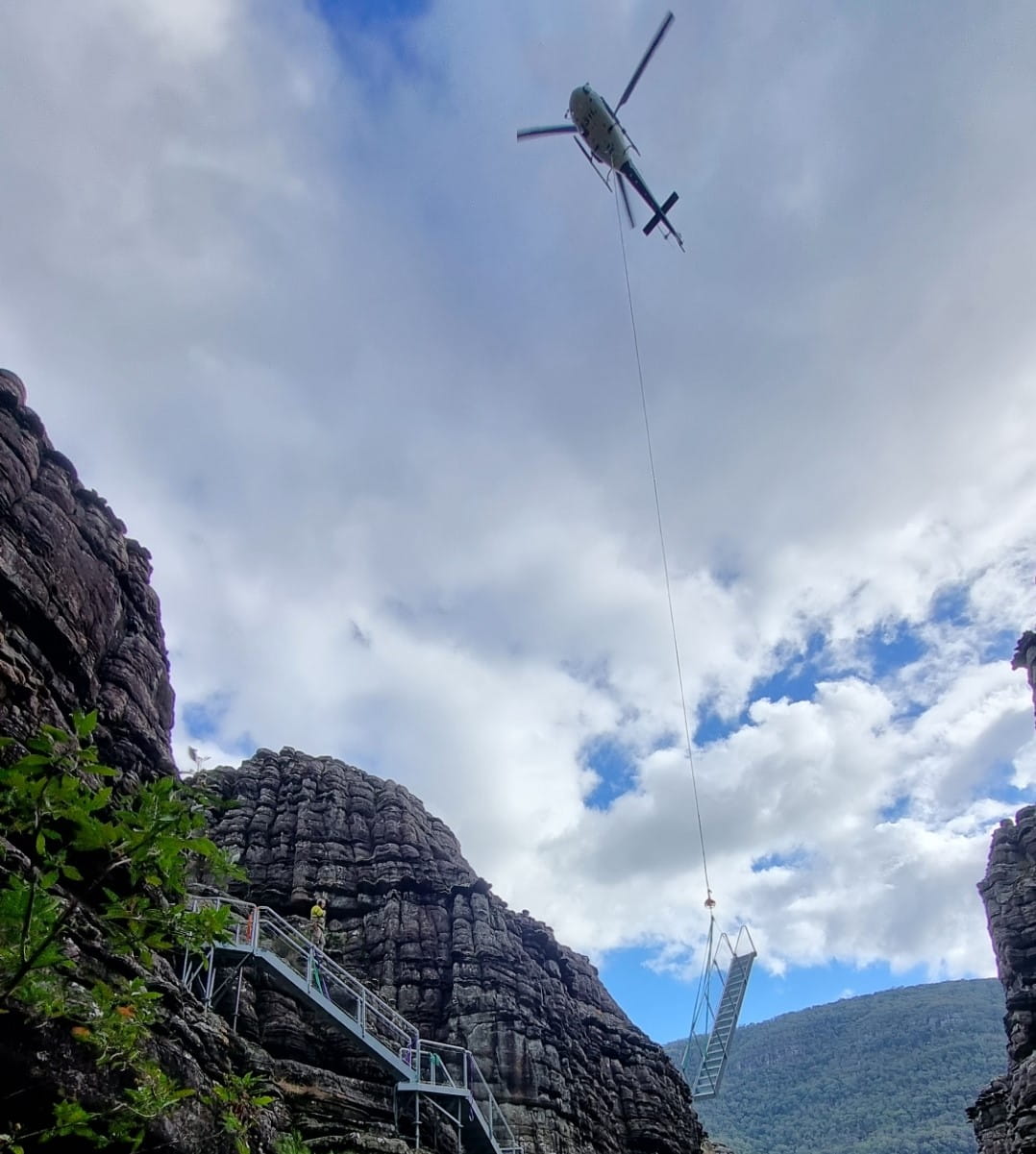 A view from below, as a helicopter lifts in part of the new Grand Canyon staircase. 