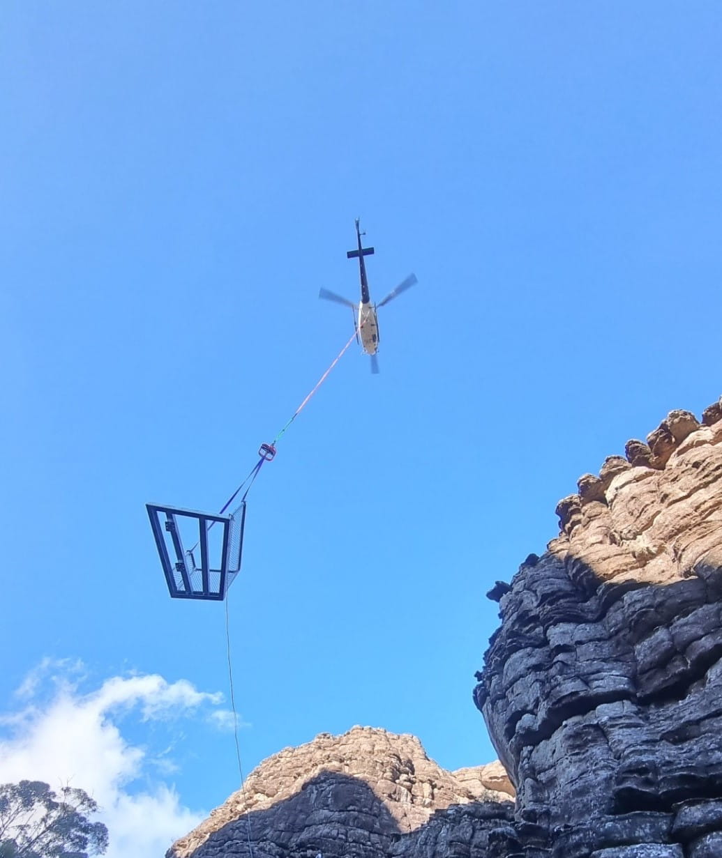 A view from below, as a helicopter lifts in part of the new Grand Canyon staircase. 