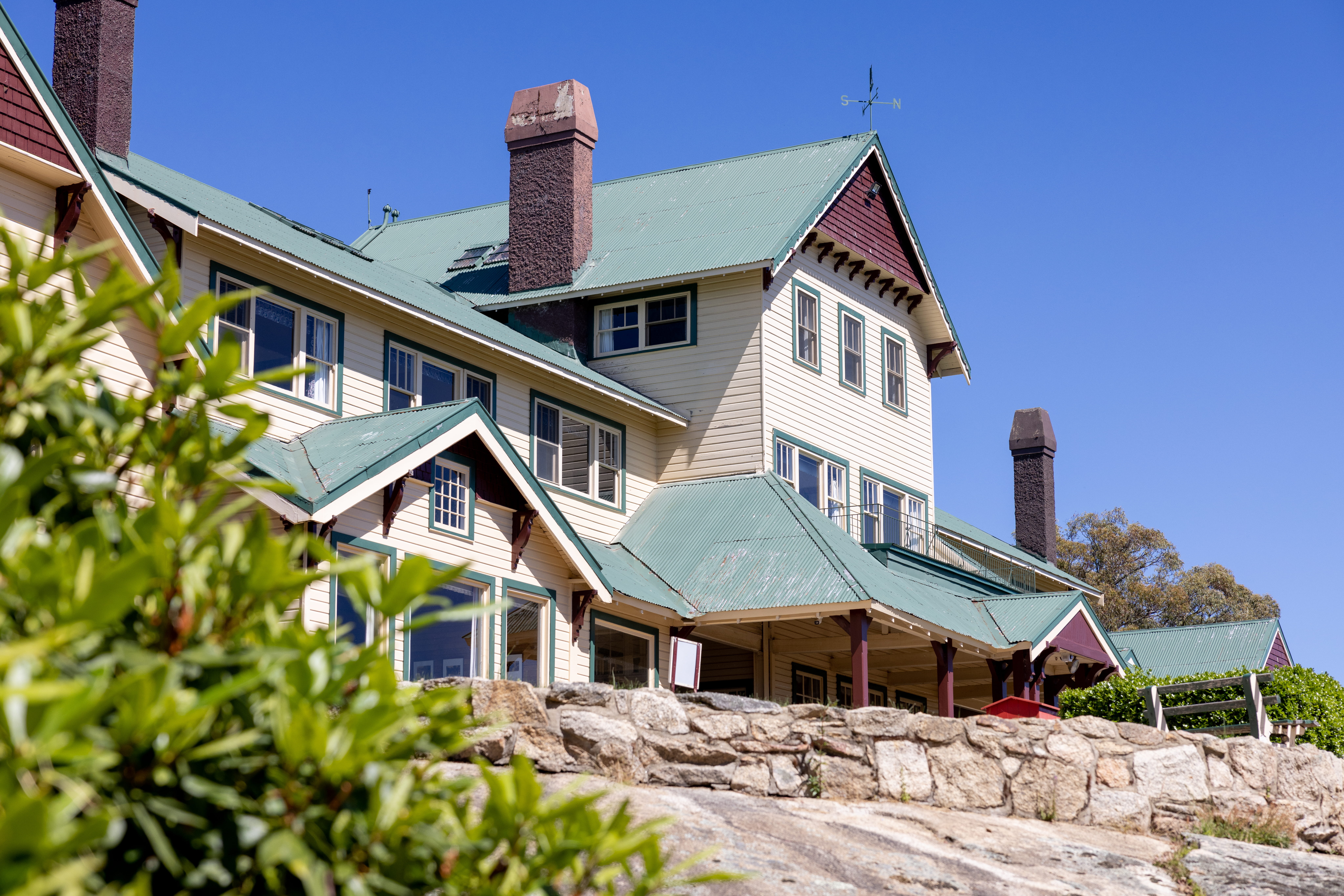 Looking up at the Mount Buffalo Chalet on a clear and bright day