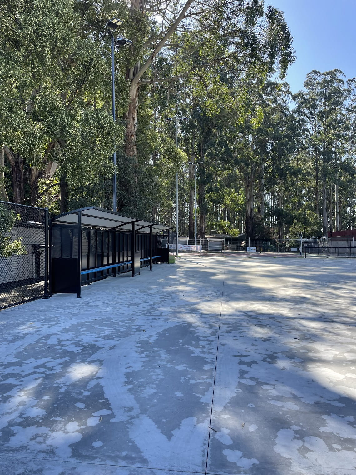The new netball court at Olinda Recreation Reserve. Concrete has been poured, and a new shelter has been installed. The acrylic surface is yet to be installed.