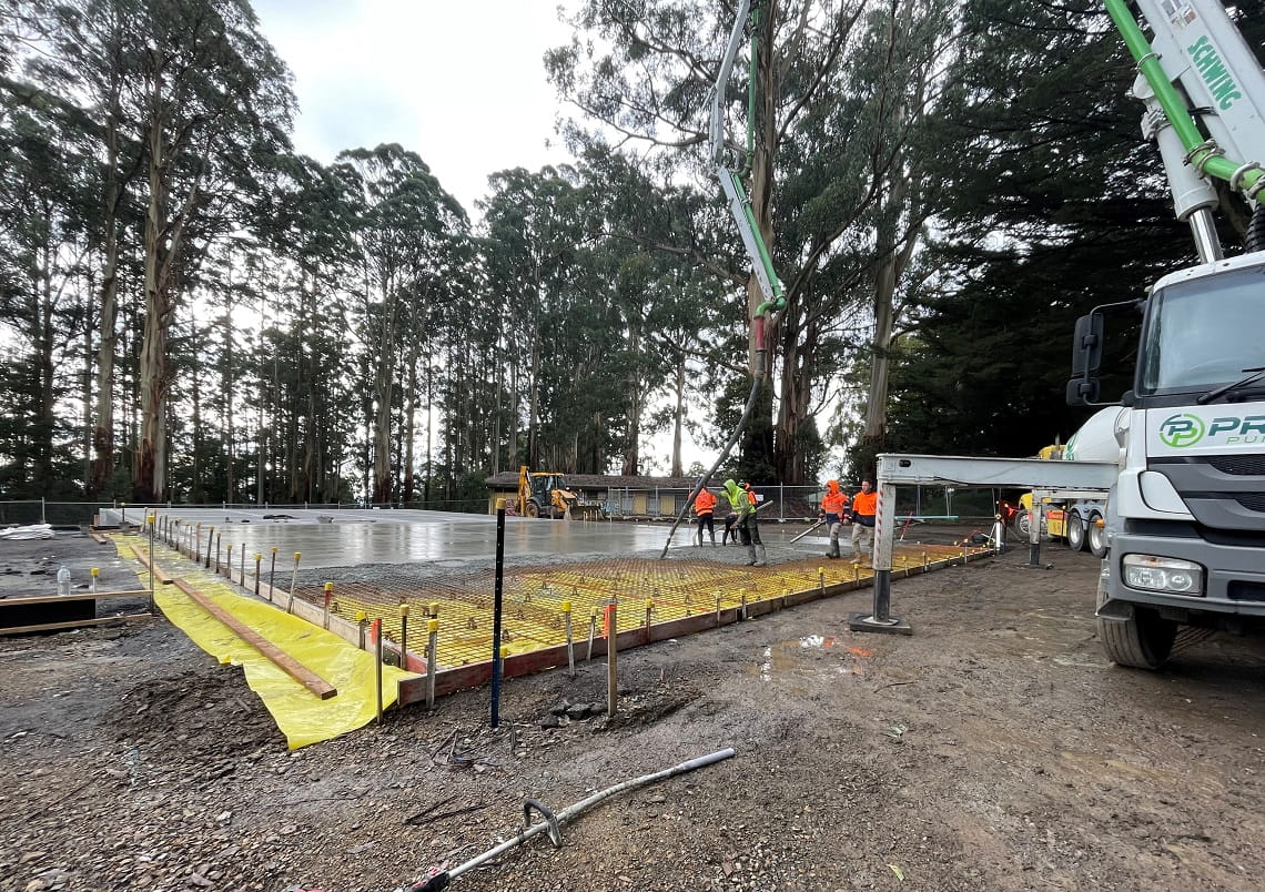 The concrete slab being poured to provide the base for the new cricket practice nets.  