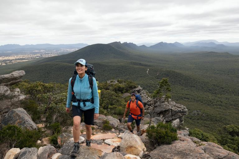 Two hikers climb the Grampians Peaks Trail. 