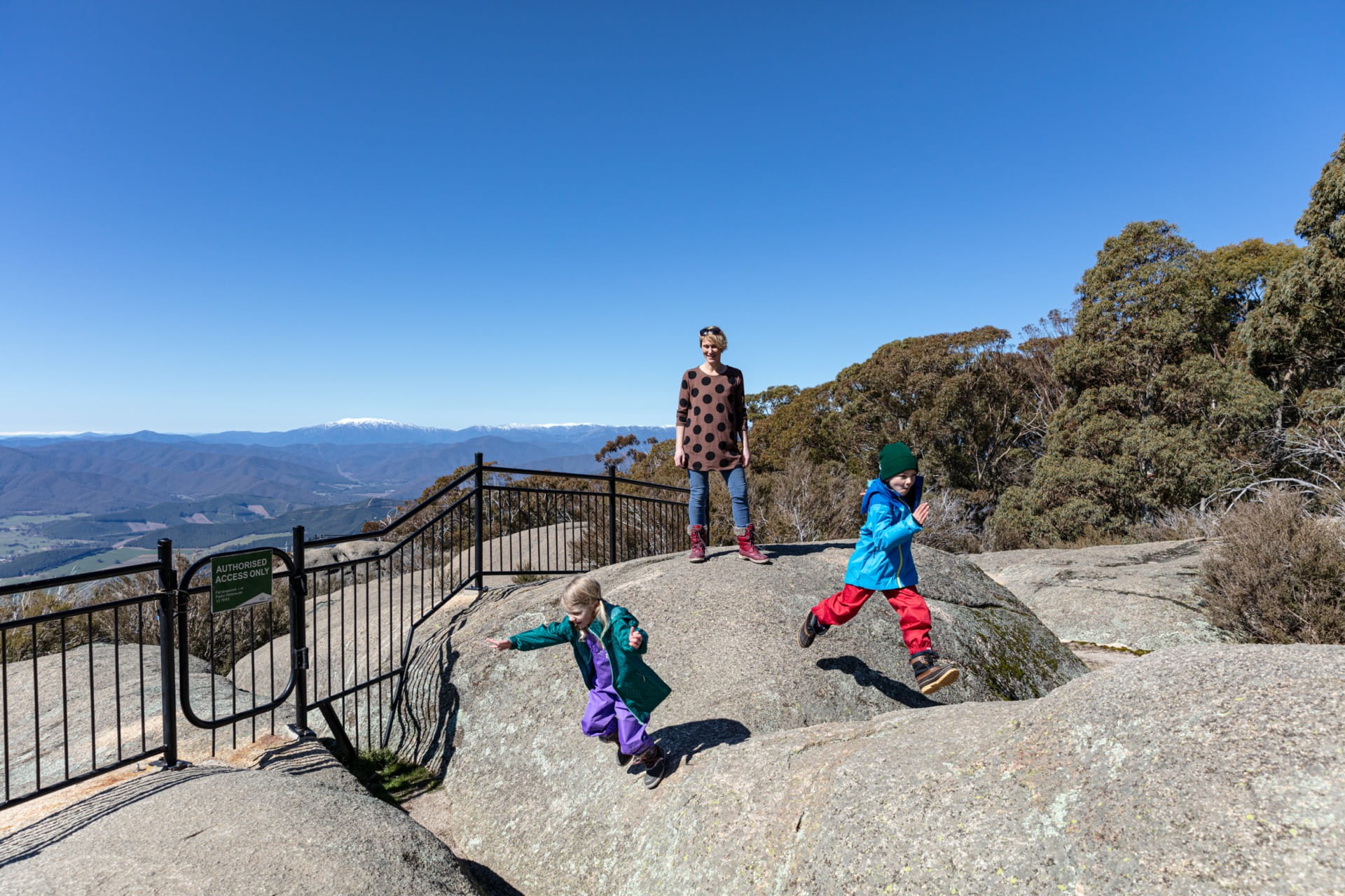 A family plays at Mount Buffalo National Park gorge.