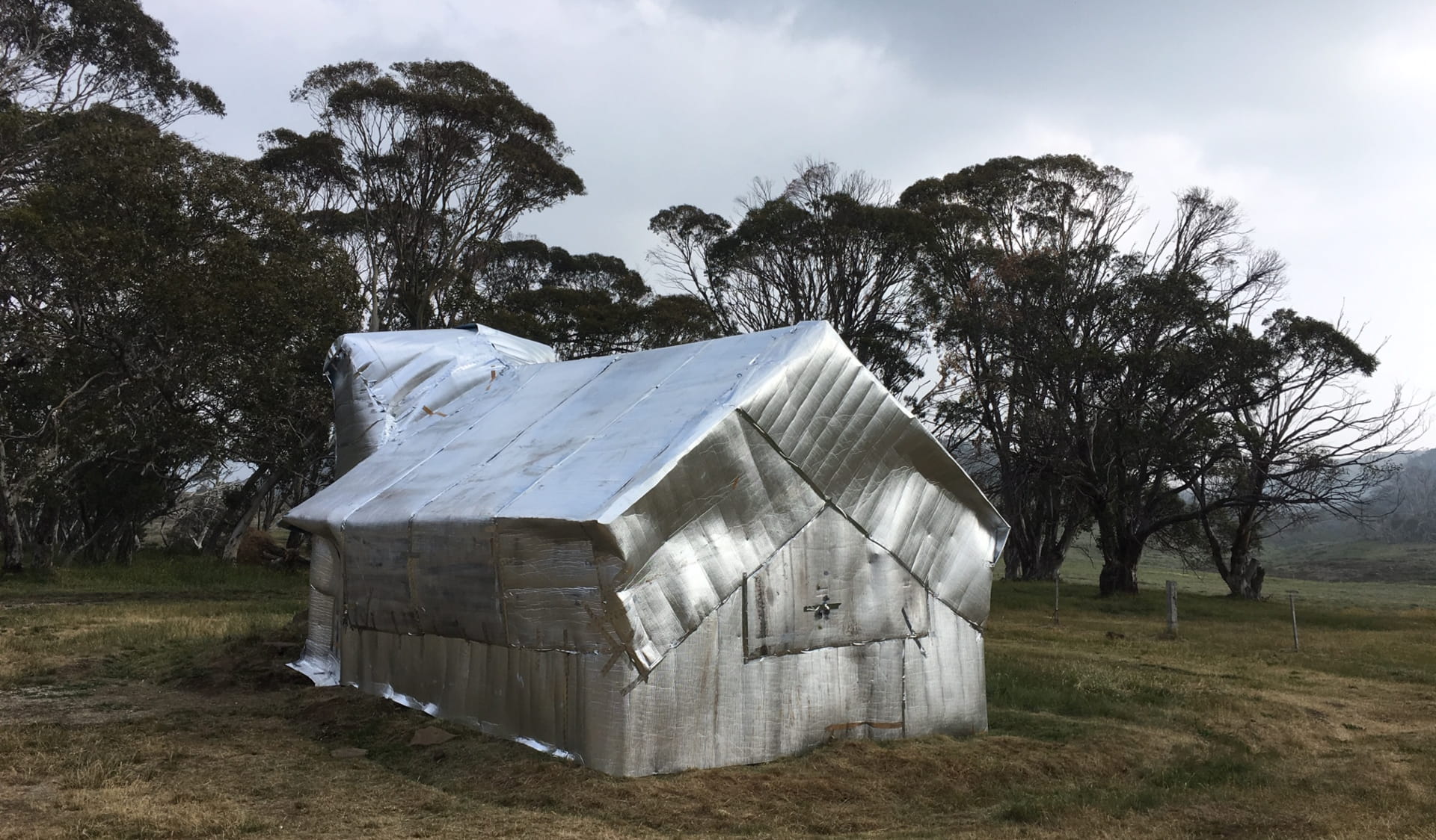 Alpine Huts wrapped to protect them from fire