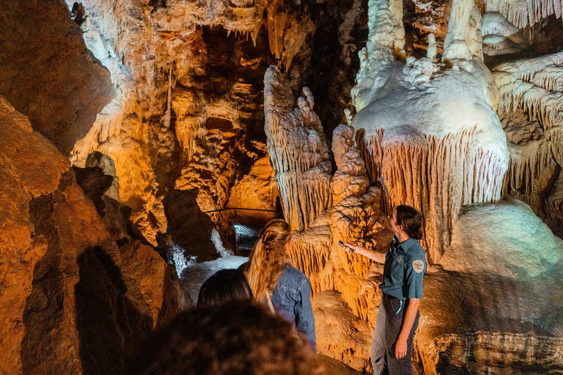 Ranger leading a tour for one woman in Buchan Caves
