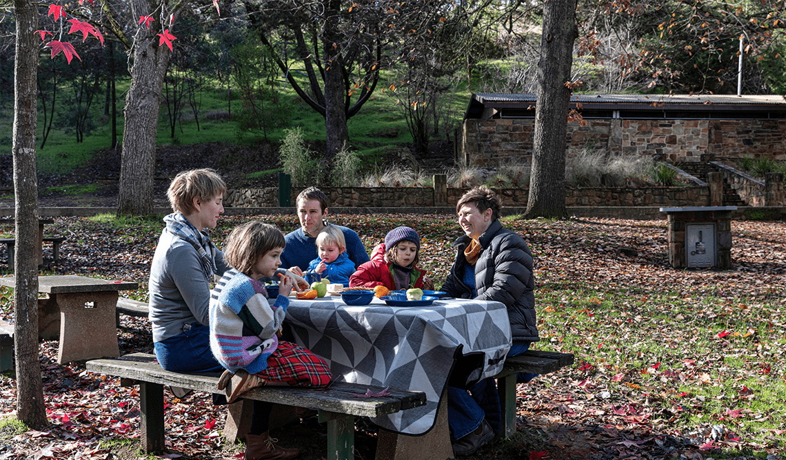 A family at a picnic table in Castlemaine Diggings National Heritage Park