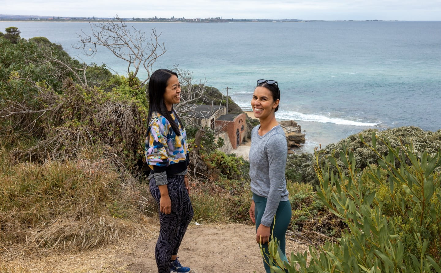 Two people looking out over Fort Nepean to Port Phillip Bay