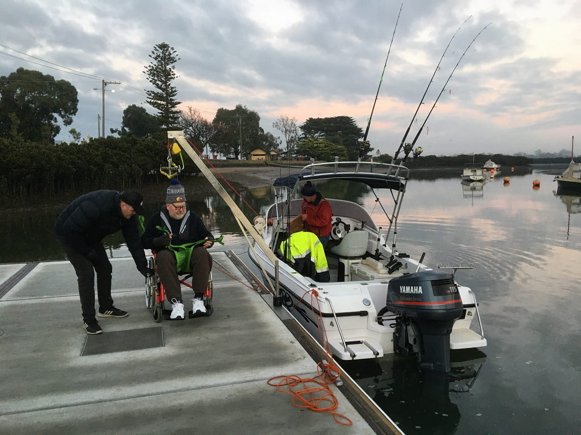 Using the hoist to safely move Mario into the boat at Tooradin Jetty.