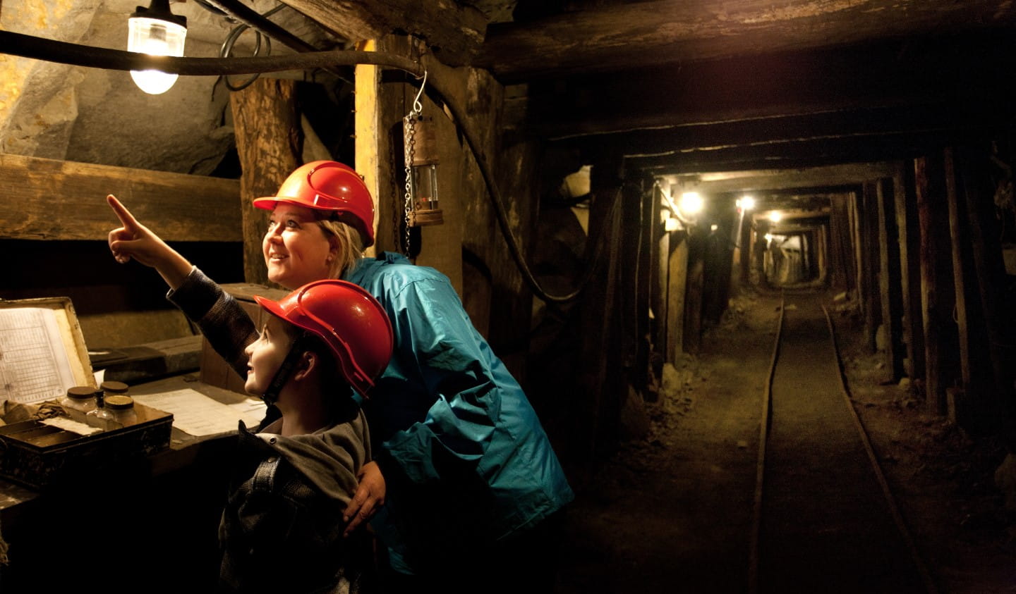 Two people on a tour of the State Coal Mine