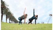 Two woman doing yoga in Albert Park