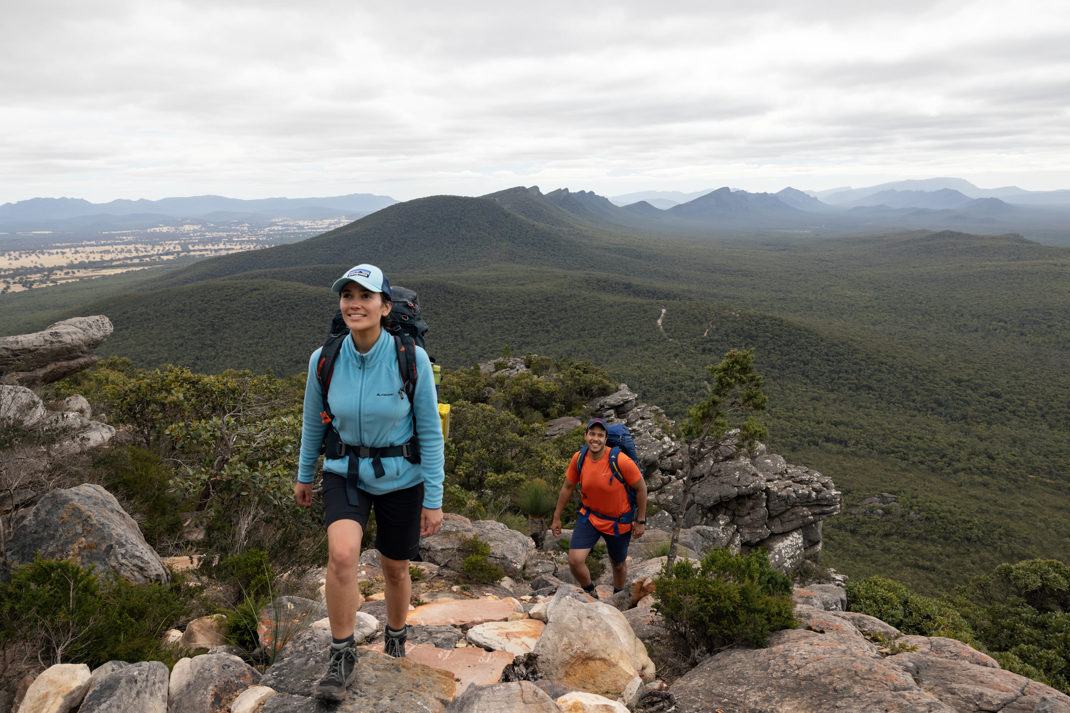 Two hikers with ridgeline in background