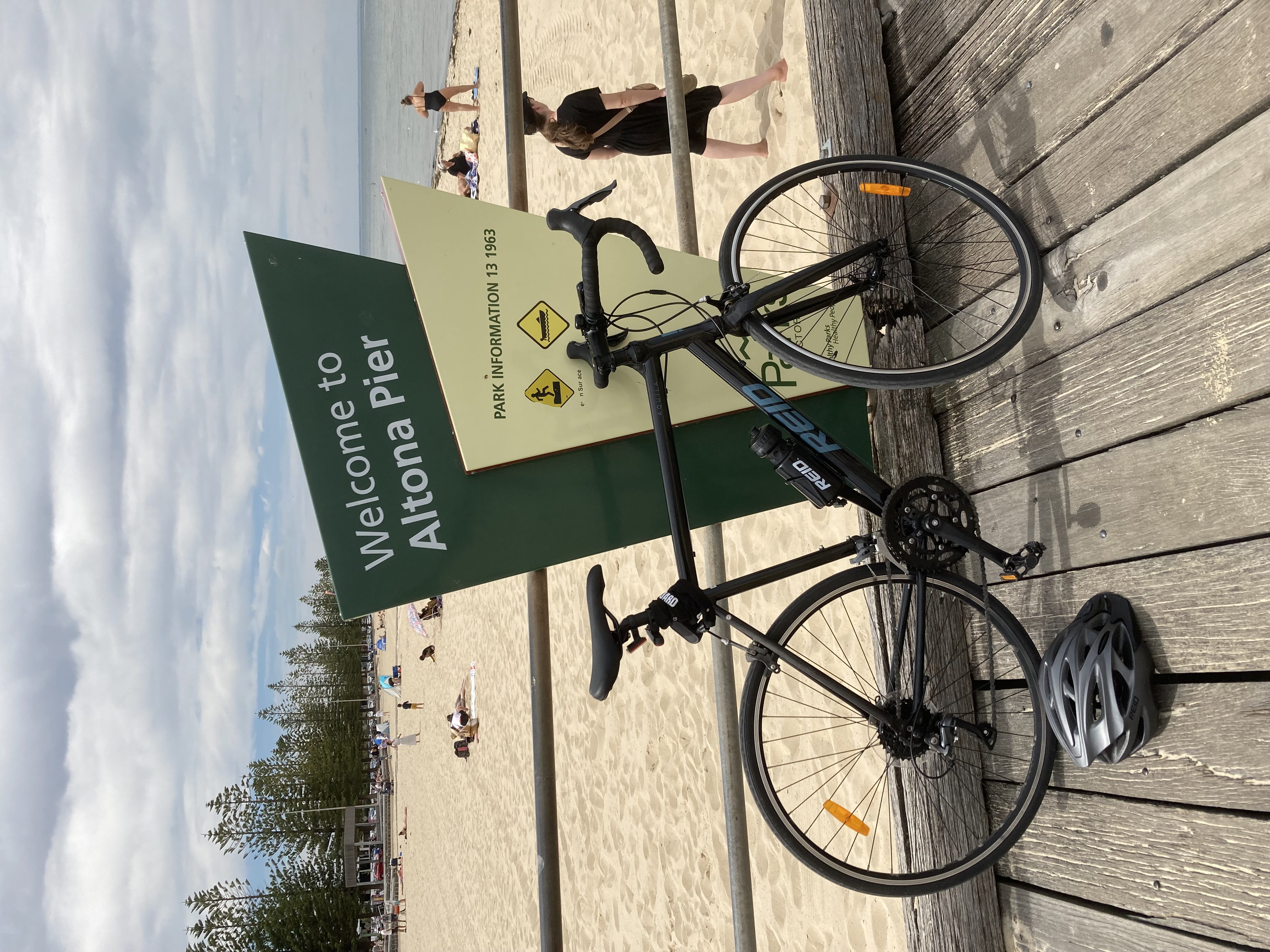 A bike leans against a sign saying 