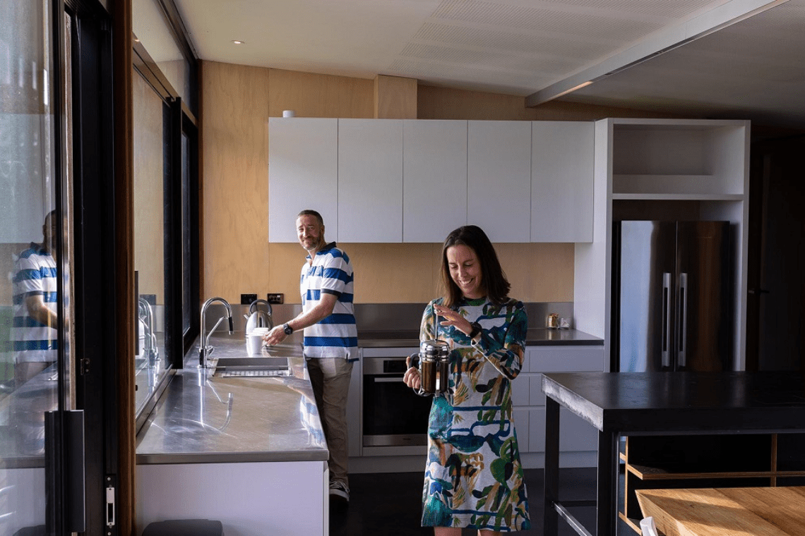 Two people in a brightly lit room