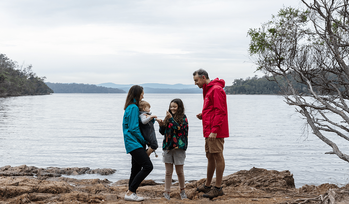 A family beside the water at Mallacoota Inlet, Croajingolong National Park