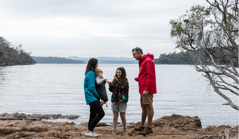 A family beside the water at Mallacoota Inlet, Croajingolong National Park