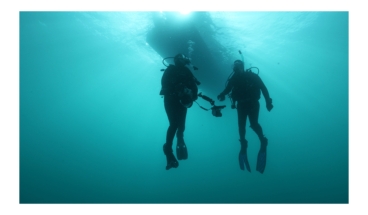 Two scuba divers at The Arches Marine Sanctuary
