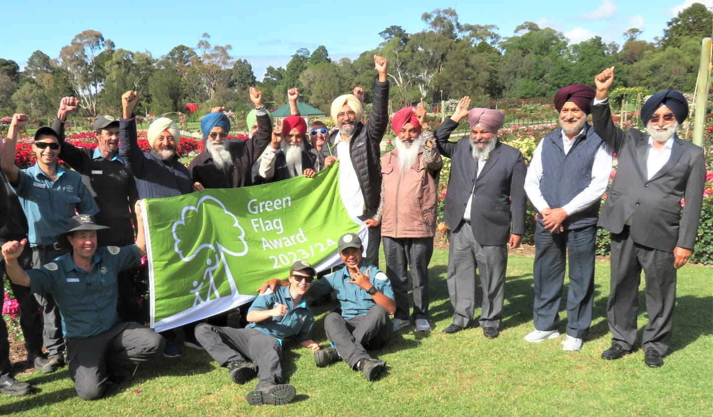 Members of the Harmony Club celebrate Werribee Park's Green Flag Award with Parks Victoria staff.