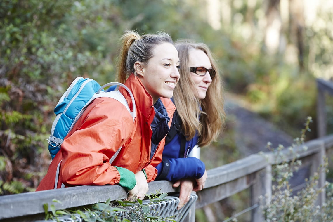 Hiking tourism adventure. Backpacker hiker woman looking at