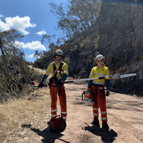 Two Parks Victoria employees standing in Alpine National Park