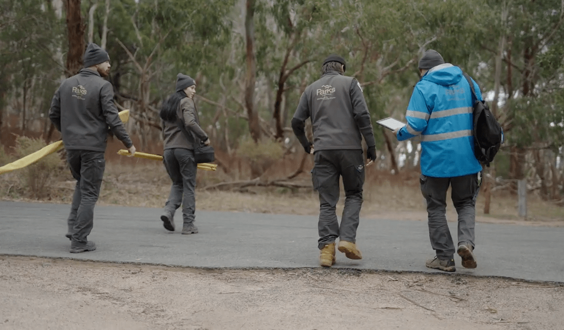 Four cultural heritage rangers crossing the road on Dja Dja Wurrung Country
