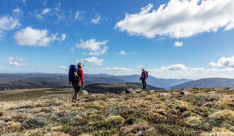 A couple walk along the Bogong High Plains near Mt Nelse.